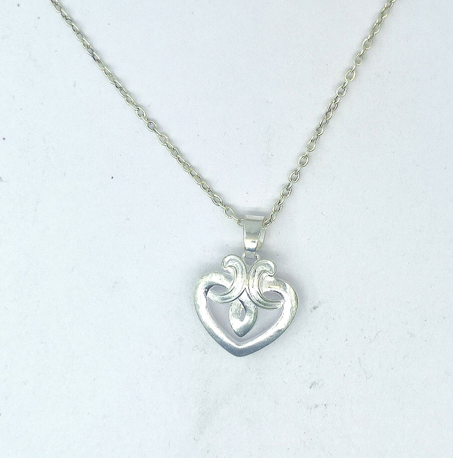 Silver Heart Pendant with Nested Heart Design 06