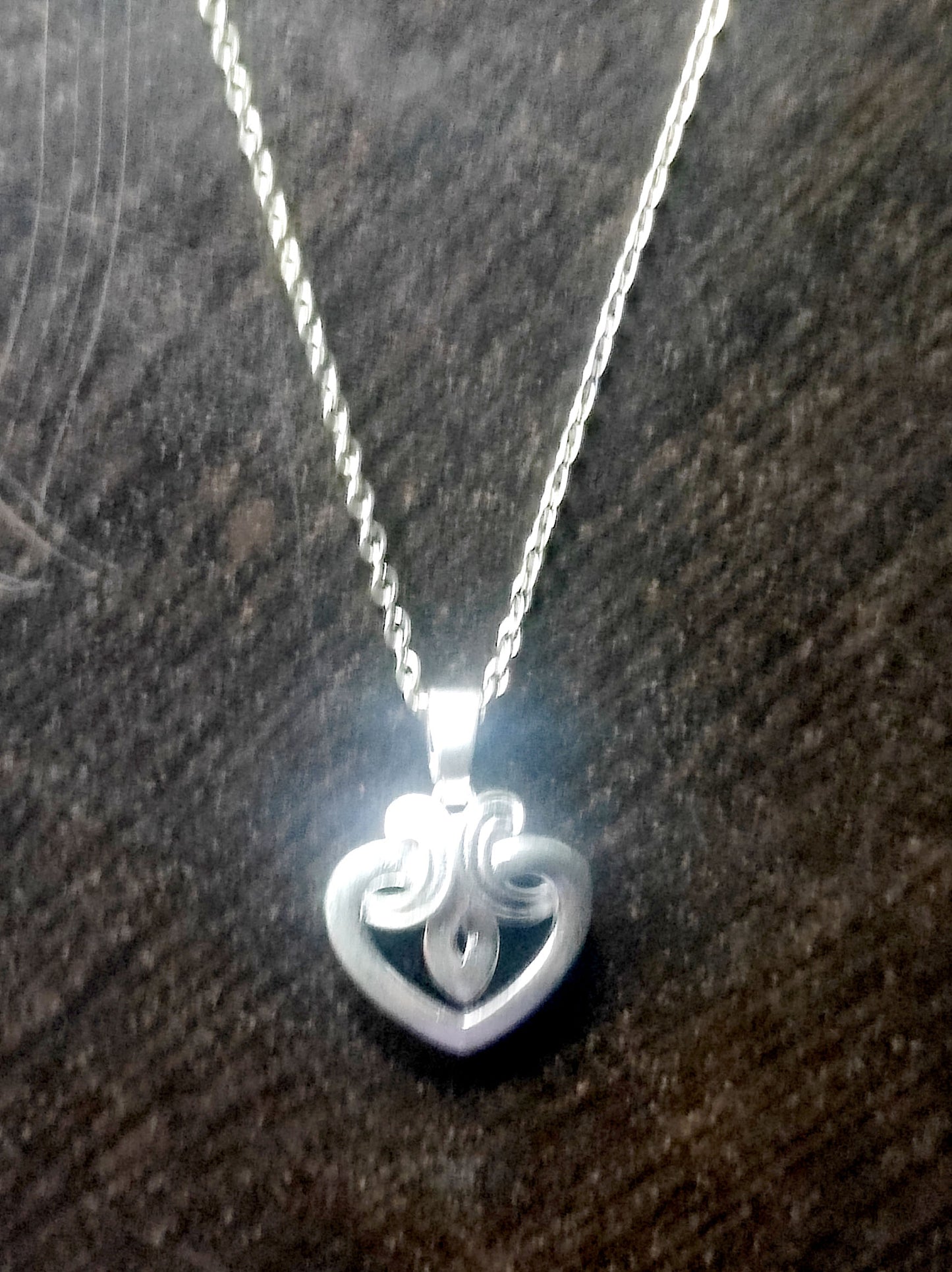 Silver Heart Pendant with Nested Heart Design 06